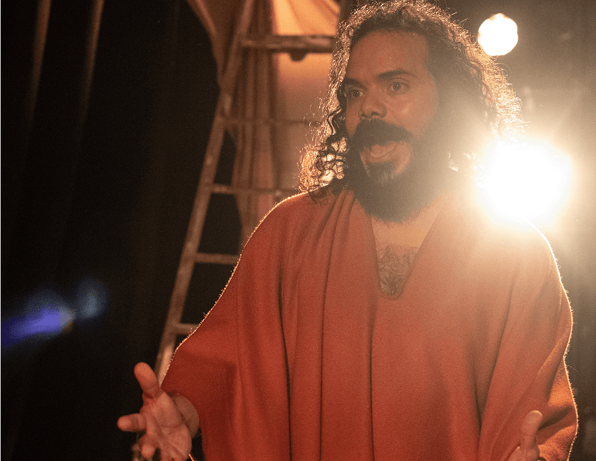 Actor delivering a powerful monologue under stage lights in Flute Theatre’s immersive Shakespeare performance of Pericles tailored for main stage production
